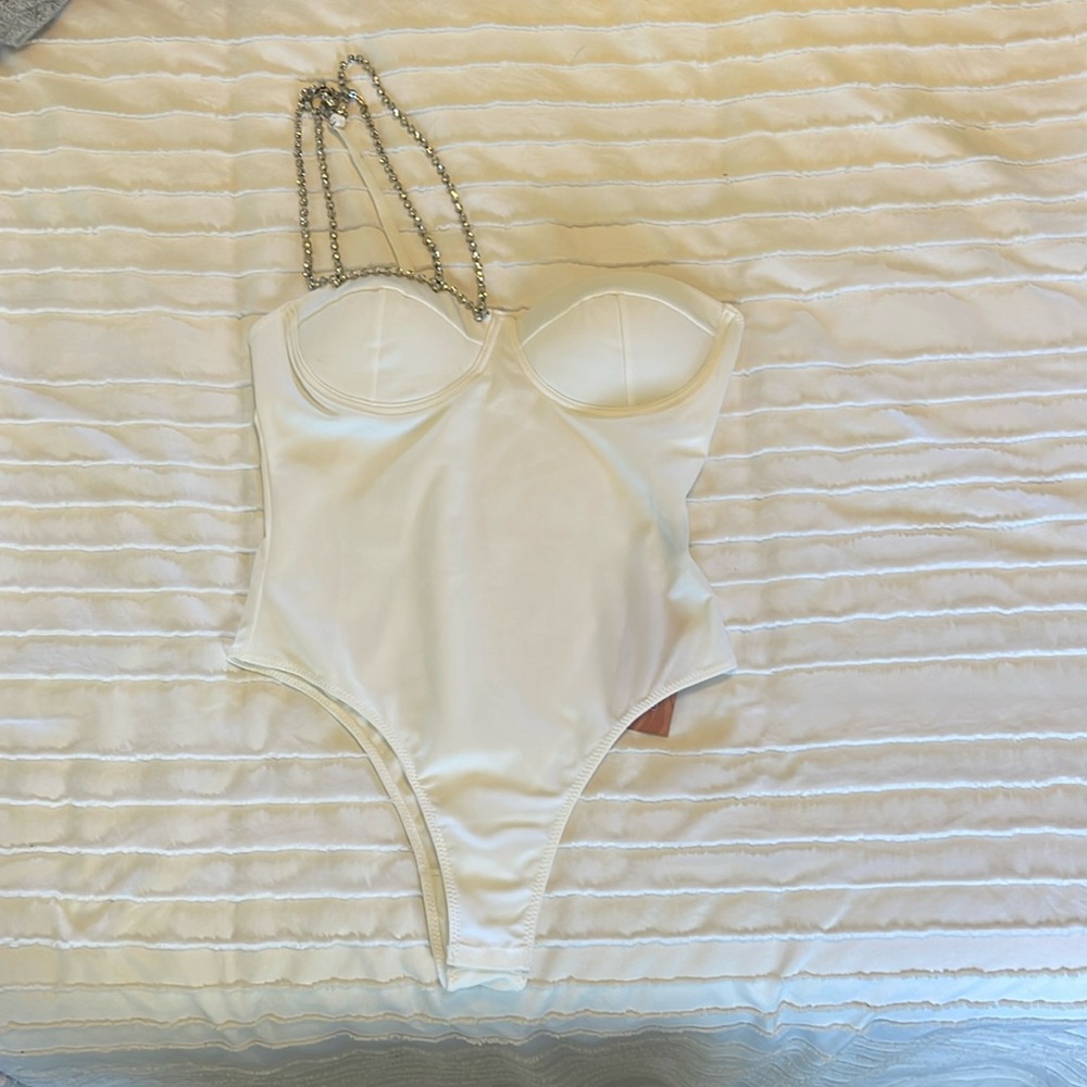 Brand new with tags white body suit with beaded strap.